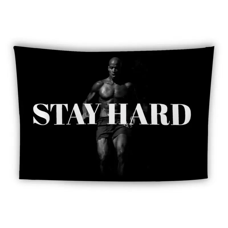 A muscular person is running, with the words "STAY HARD" written in large, bold, white letters across the image. The background is black, creating a high contrast with the text and the runner's silhouette.