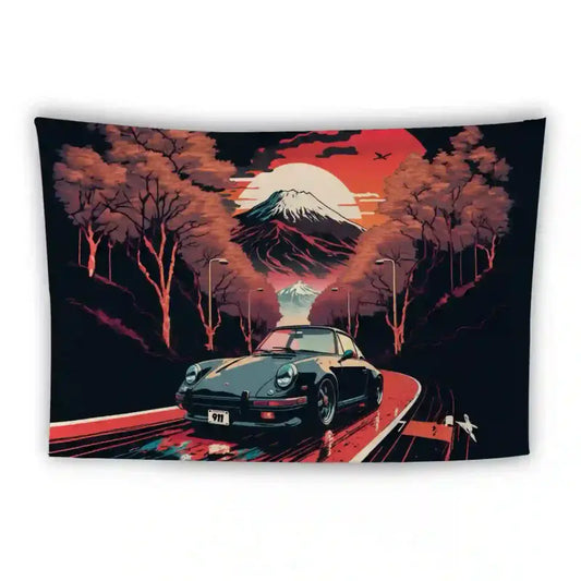 A vibrant artwork features a classic black car driving on a winding road through a forest with colorful trees. A snow-capped mountain and a setting or rising sun dominate the background, while a bird soars in the sky. The license plate on the car reads "911.