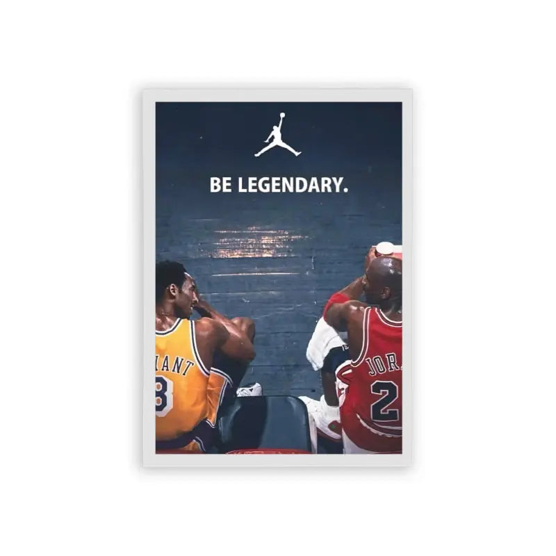 Basketball 'Legendary Jump' Framed Poster White Hard Fiber An iconic sports moment captured with two legendary basketball players in their team jerseys, set against a star-studded skyline, urging viewers to 'be legendary' beneath the famous jumpman logo. This moment is