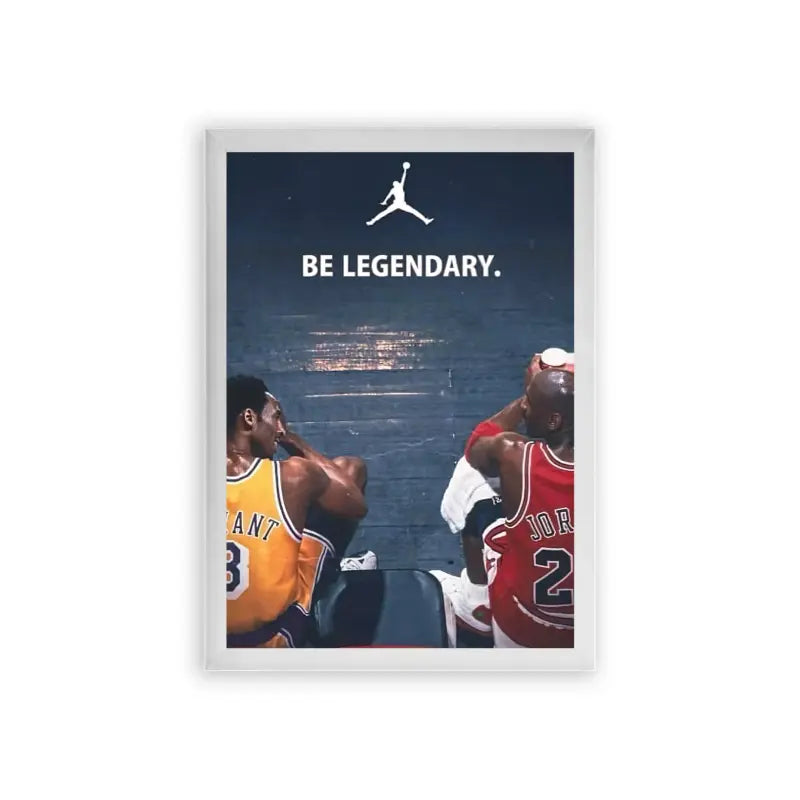 Basketball 'Legendary Jump' Framed Poster White Premium Wood An iconic sports moment captured with two legendary basketball players in their team jerseys, set against a star-studded skyline, urging viewers to 'be legendary' beneath the famous jumpman logo. This moment is