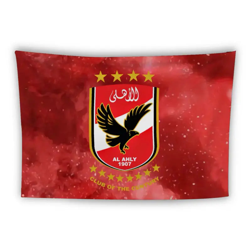 A red banner displays an emblem of Al Ahly SC, featuring a flying eagle with spread wings, text in Arabic at the top, and the year "1907" at the bottom. The emblem is surrounded by seven golden stars, with the phrase "Club of the Century" at the bottom.