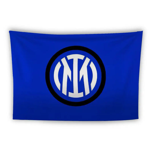 A rectangular blue flag featuring the logo of Inter Milan. The logo consists of the letters "IM" intertwined within a black and white circular emblem located centrally on the flag.