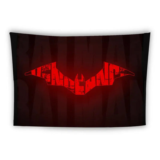 A tapestry features a bold, red bat emblem at its center against a dark background. The bat is stylized with sharp, angular lines and subtle texture details, while the background appears to be gradient with the word "BATMAN" faintly visible in large, dark letters.