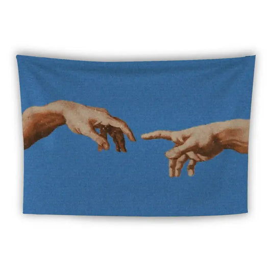 A blue tapestry depicts two hands reaching towards each other, resembling Michelangelo's "The Creation of Adam." The hands are drawn in a realistic style, with one pointing and the other open, set against a solid blue background.