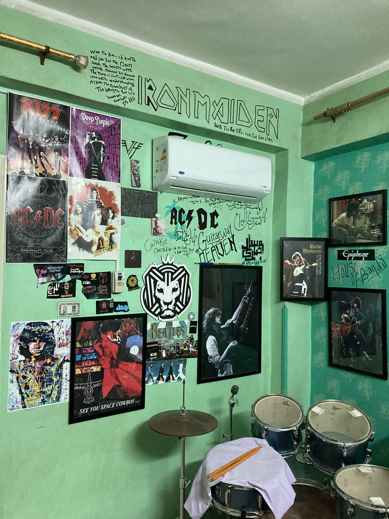 Spark frames on a green music-room wall