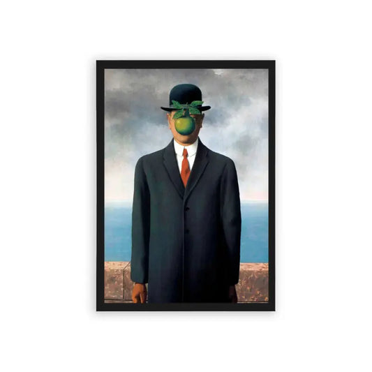 Surreal 'Apple Of My Eye' Framed Poster Black Hard Fiber A surrealist artwork featuring a man in a suit with an apple obscuring his face, set against a backdrop of a cloudy sky and ocean horizon.