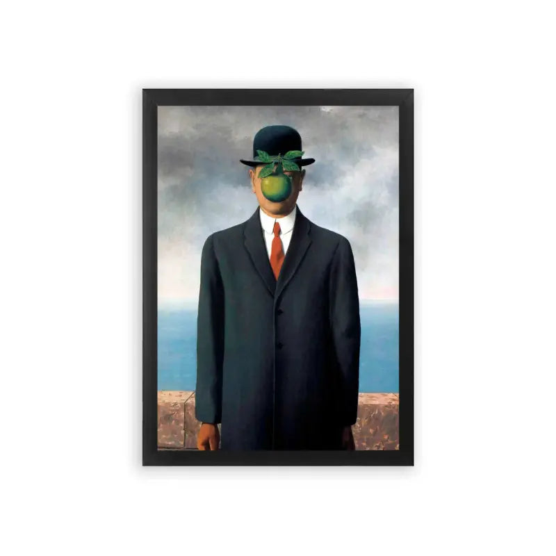 Surreal 'Apple Of My Eye' Framed Poster Black Premium Wood A surrealist artwork featuring a man in a suit with an apple obscuring his face, set against a backdrop of a cloudy sky and ocean horizon.