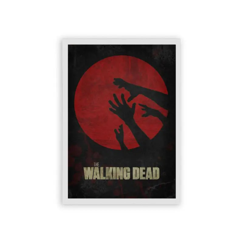 The Walking Dead 'Grips of the Undead' Framed Poster White Hard Fiber The image is a poster for the tv series "the walking dead." it features a dark silhouette of a group of hands reaching upwards against a backdrop of a red circle, suggesting a sense of horror and desperation, which is fitting for the show's zombie apocalypse theme.