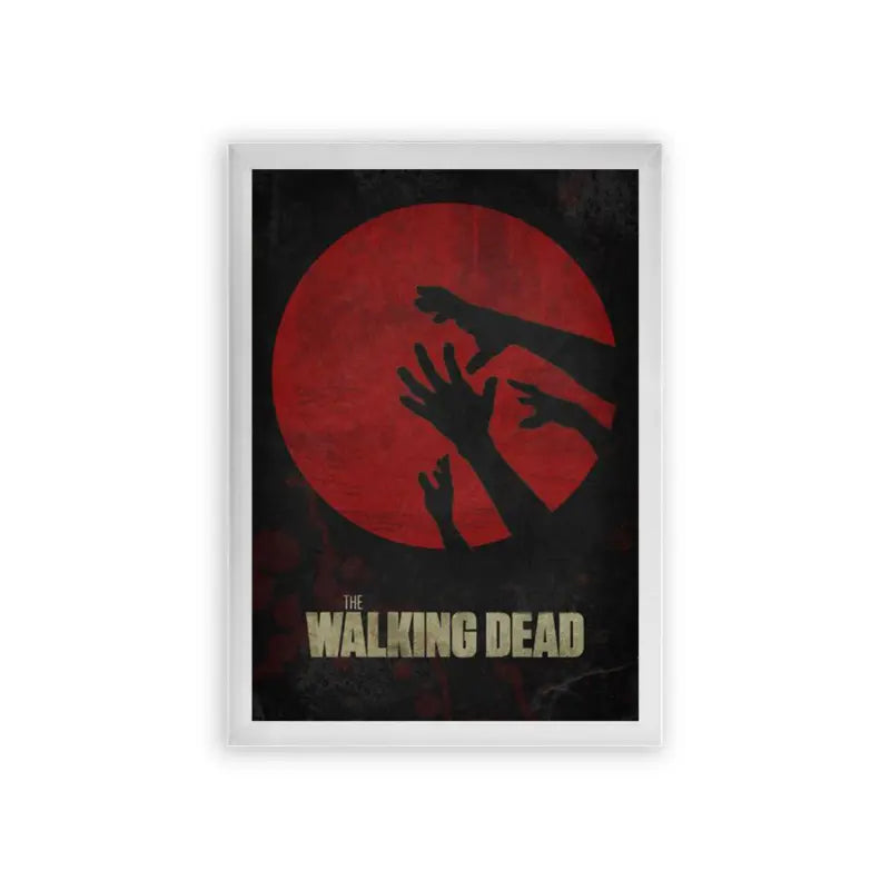 The Walking Dead 'Grips of the Undead' Framed Poster White Premium Wood The image is a poster for the tv series "the walking dead." it features a dark silhouette of a group of hands reaching upwards against a backdrop of a red circle, suggesting a sense of horror and desperation, which is fitting for the show's zombie apocalypse theme.