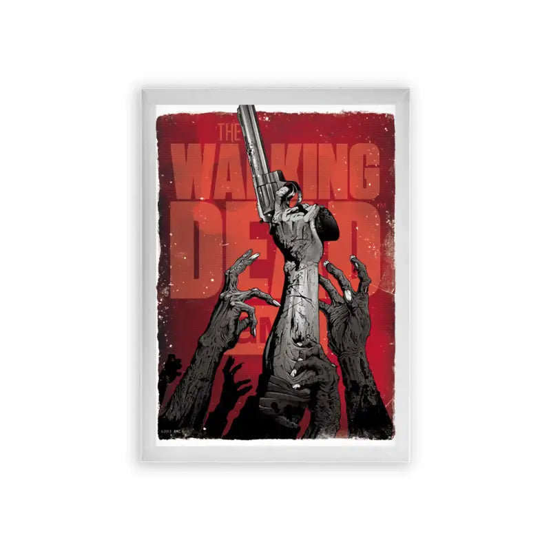 The Walking Dead 'Undead Uprising' Framed Poster White Premium Wood A stylized poster of 'the walking dead' featuring a lone figure brandishing a gun, surrounded by outstretched hands of the undead, all set against a backdrop of ominous red.