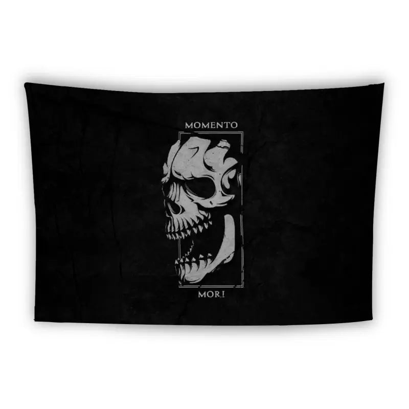 A black rectangular tapestry features a white, stylized skull on the right side, partially enclosed in a rectangular frame with intricate detailing. Above the skull, the text reads "MOMENTO MORI" in capital letters.