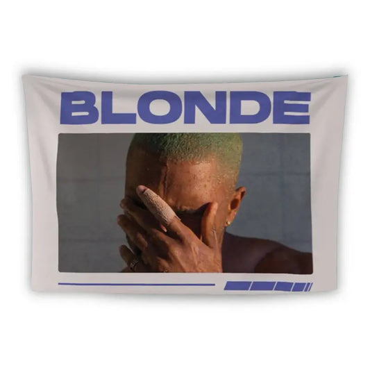 The image is of an album cover with the text "BLONDE" in large blue letters at the top. Below the text is a photo of a person with green hair, holding their face with both hands. The background and borders of the image are white.