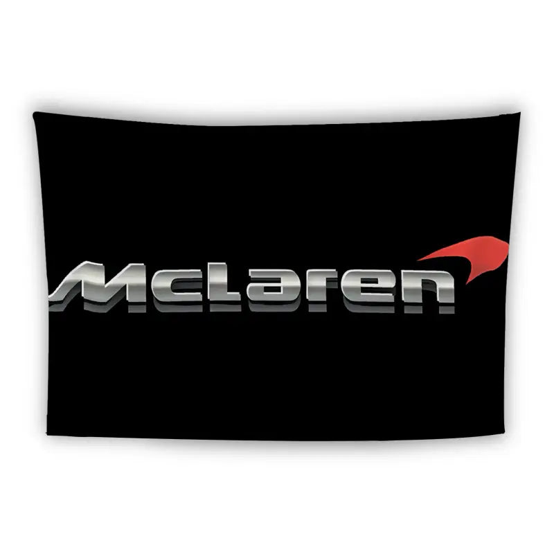 A black banner featuring the McLaren logo in silver, with a red swoosh graphic to the right of the text. The logo is centered on the black background.