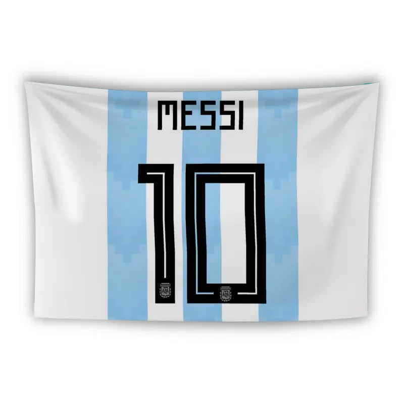 A flag features the back of a soccer jersey with light blue and white vertical stripes. The name "Messi" is written in black at the top, and the number "10" is prominently displayed below it. Small Argentine Football Association logos are placed at the bottom corners of the number.