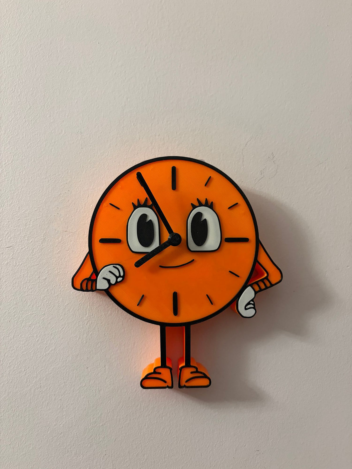Miss Minutes clock hanging on a wall