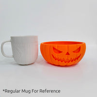 Pumpkin bowl next to a regular mug for size: 13 cm across, 7 cm tall
