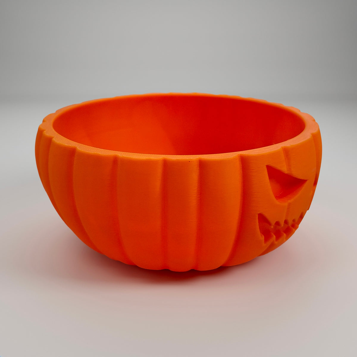 Side view of the pumpkin bowl showing its ribbed body and wide rim