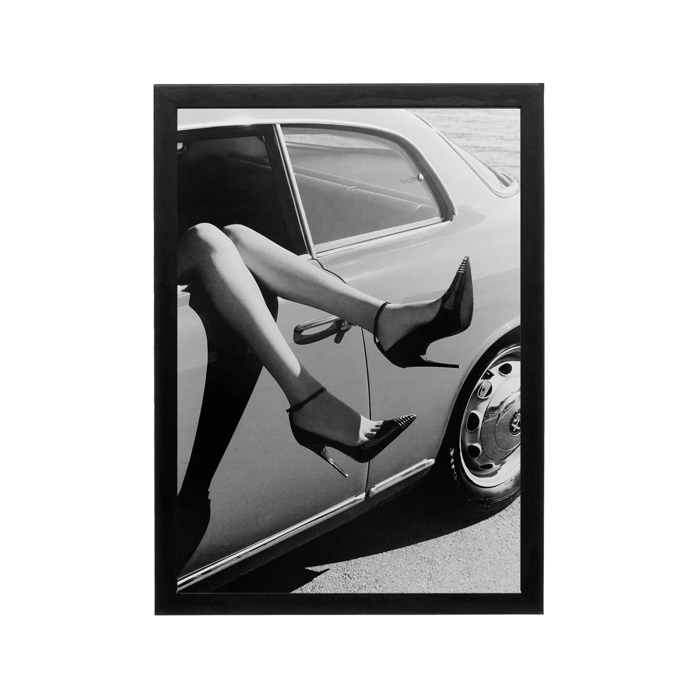 Black and white editorial print of legs exiting a car, high contrast monochrome wall art for modern interiors
