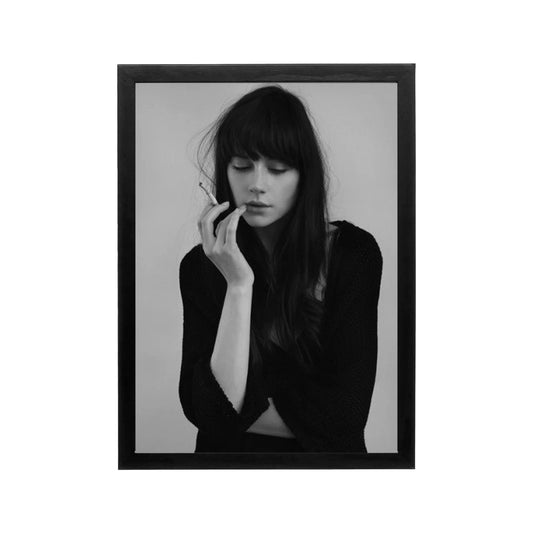 Black and white framed portrait of a woman with cigarette, minimalist editorial style for modern living room wall art