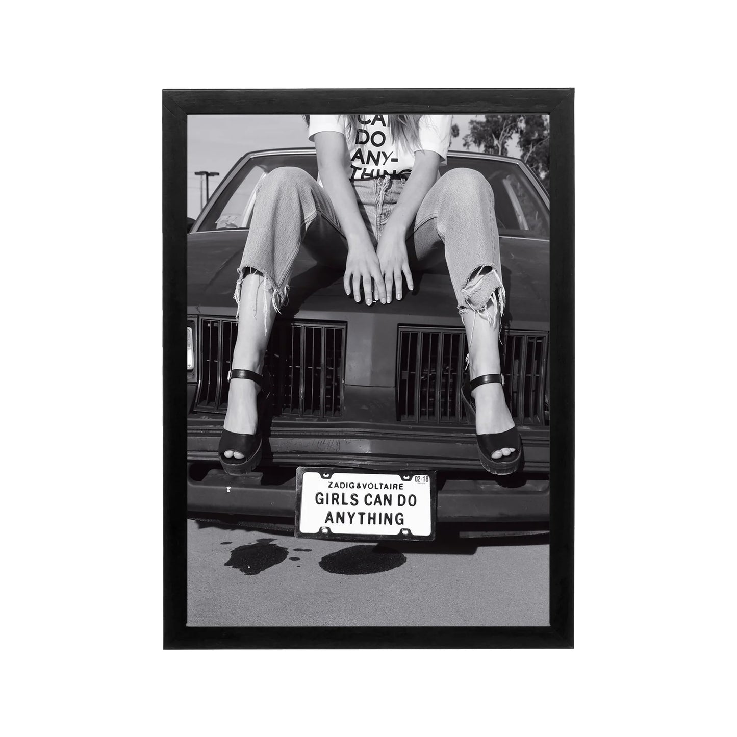 Black and white editorial print of woman on car hood with bold typography for modern wall art