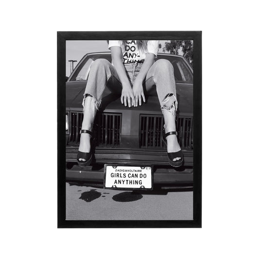 Black and white editorial print of woman on car hood with bold typography for modern wall art