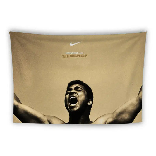 A tapestry featuring a stylized image of a boxer standing triumphantly over a fallen opponent on a gray mat. Above the boxers, white text reads, "If you even dream of beating me you'd better wake up and apologize." - Muhammad Ali.